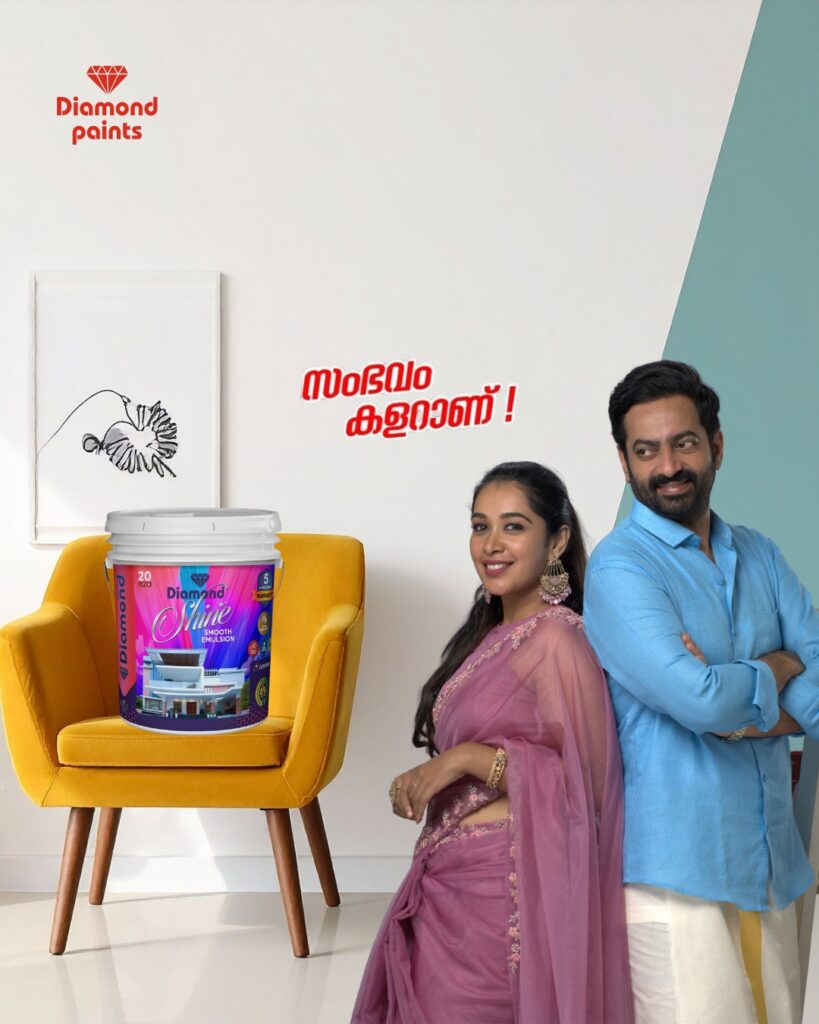 A Diamond Paints best interior paint ad showing a smiling man and woman next to a yellow chair holding a bucket of Diamond Shine bucket. Red Malayalam text 'സംഭവം കളറാണ്!' is in the center.